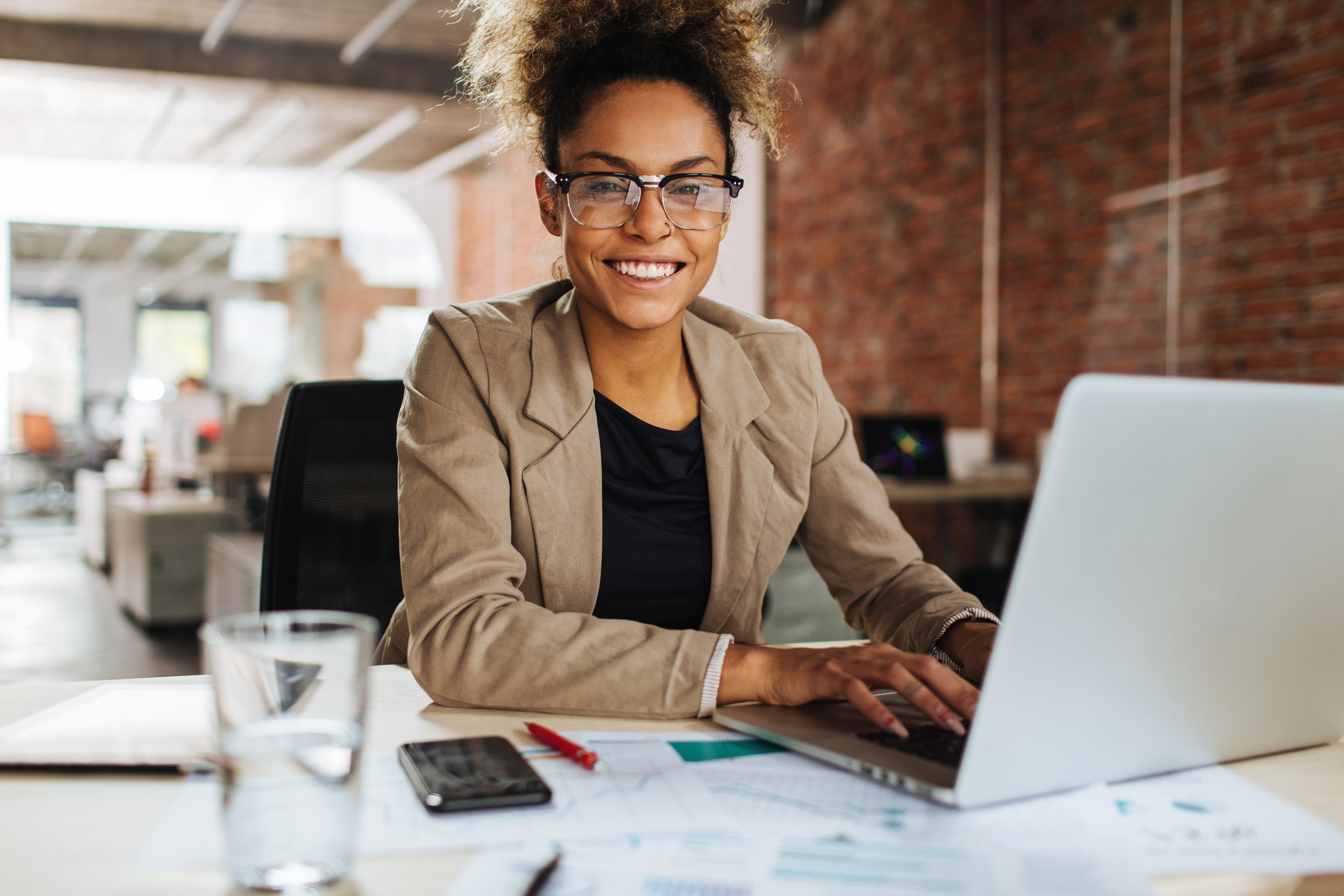 Confident woman sitting in her office